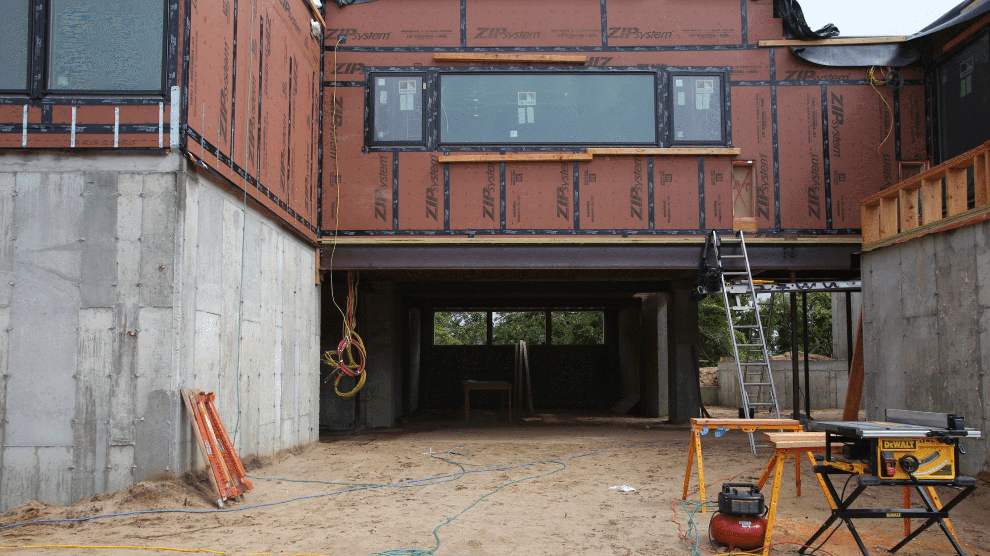 Home maintenance checklist with tools and calendar laid out on a workbench